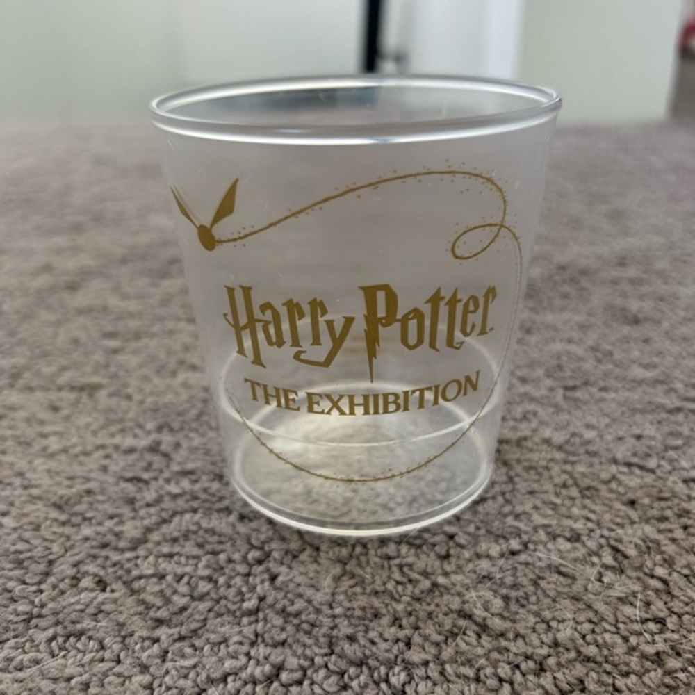 Harry Potter The Exhibition Clear and Gold Plastic Party Cup NWOT